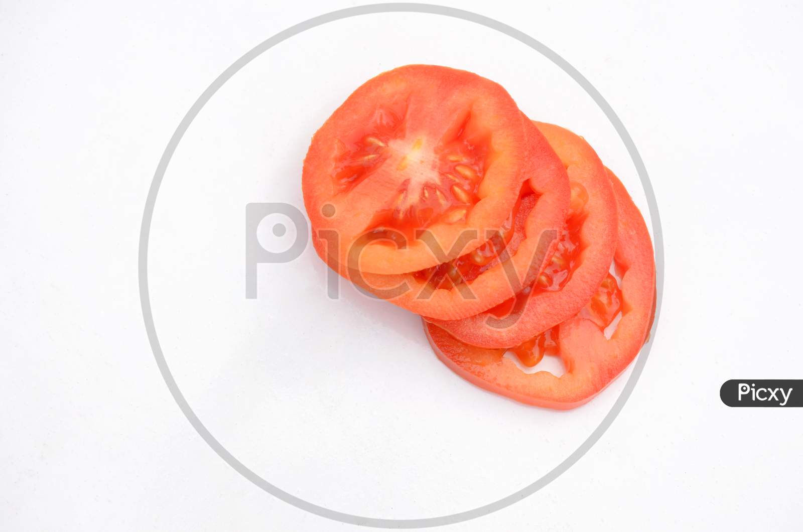 The Red Tomato Sliced Isolated On White Background.
