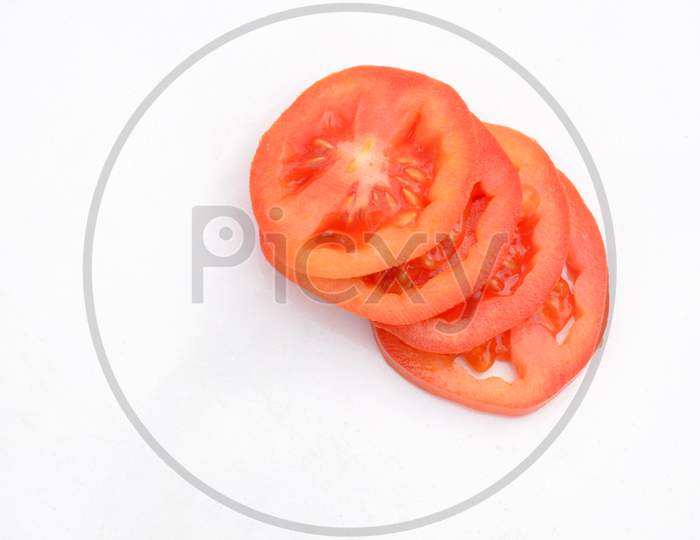 The Red Tomato Sliced Isolated On White Background.