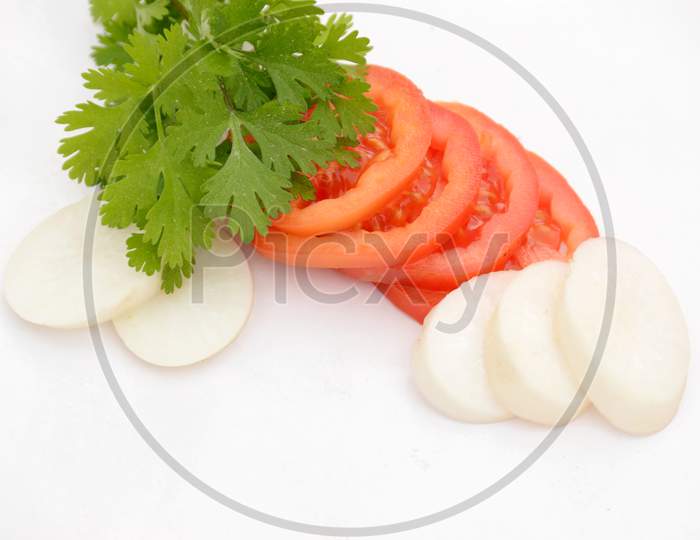 The Red Tomato With White Radish Sliced And Green Coriander Isolated On White Background.