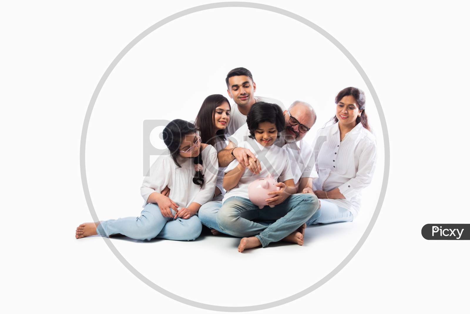 Indian Family With Piggy Bank Standing Or Sitting Isolated Against White