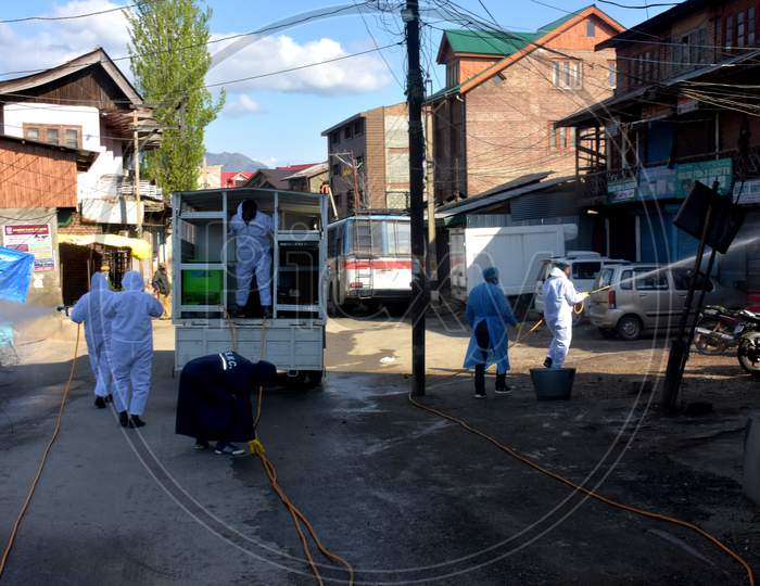 Covid Fumigation Vehicles Trucks And Frontline Heroes Wearing White Kits On Streets Empty Roads Of Srinagar City Kashmir India