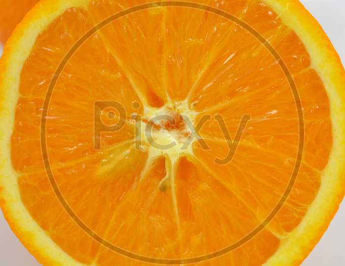 Healthy ripe delicious fruits for human health. Juicy fruits of an orange orange. Delicious fresh fruit, half orange cut.