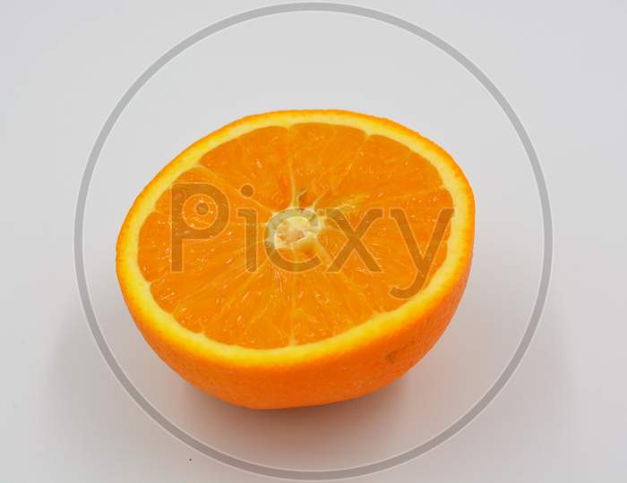 Healthy ripe delicious fruits for human health. Juicy fruits of an orange orange. Delicious fresh fruit, half orange cut.