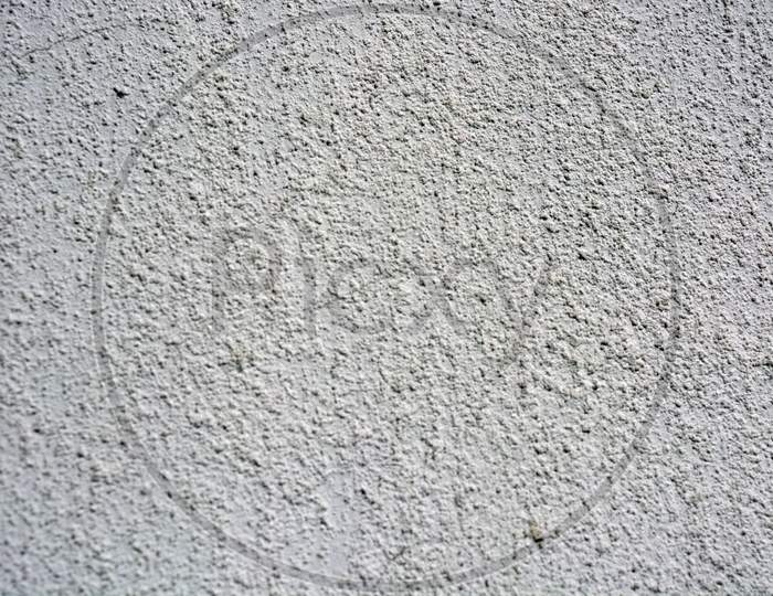 White building cement liqueous wall with structural pattern.