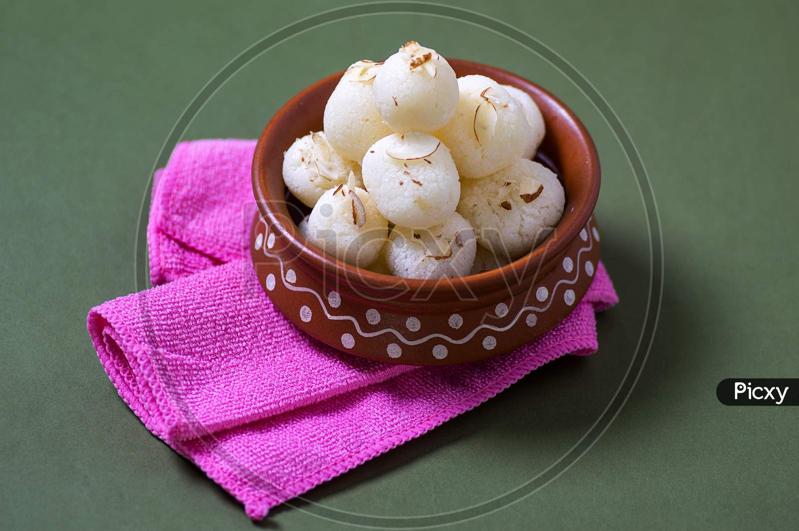 Indian Sweet - Rasgulla, Famous Bengali Sweet In Clay Bowl With Napkin