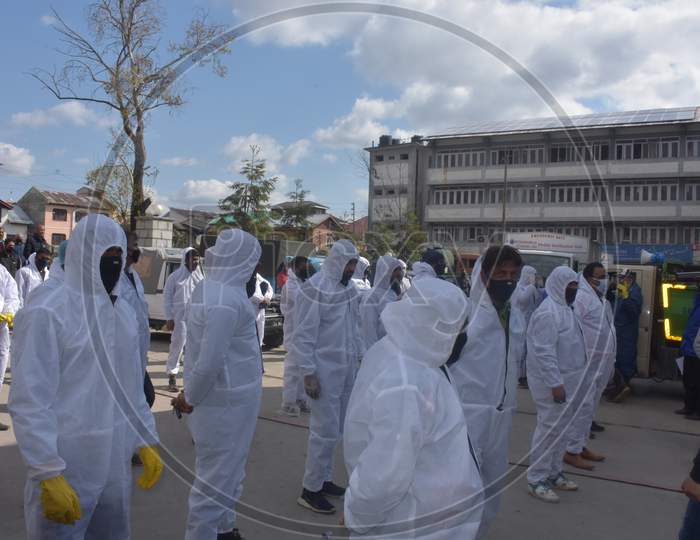 Covid Fumigation Vehicles Trucks And Frontline Heroes Wearing White Kits On Streets Empty Roads Of Srinagar City Kashmir India