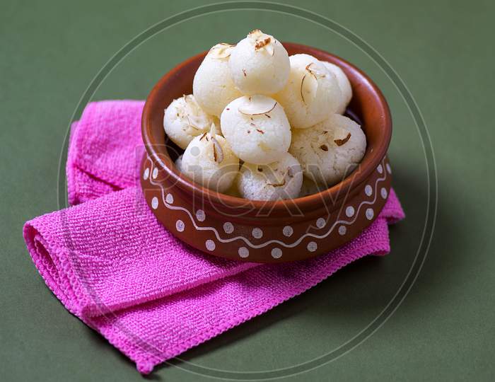 Indian Sweet - Rasgulla, Famous Bengali Sweet In Clay Bowl With Napkin