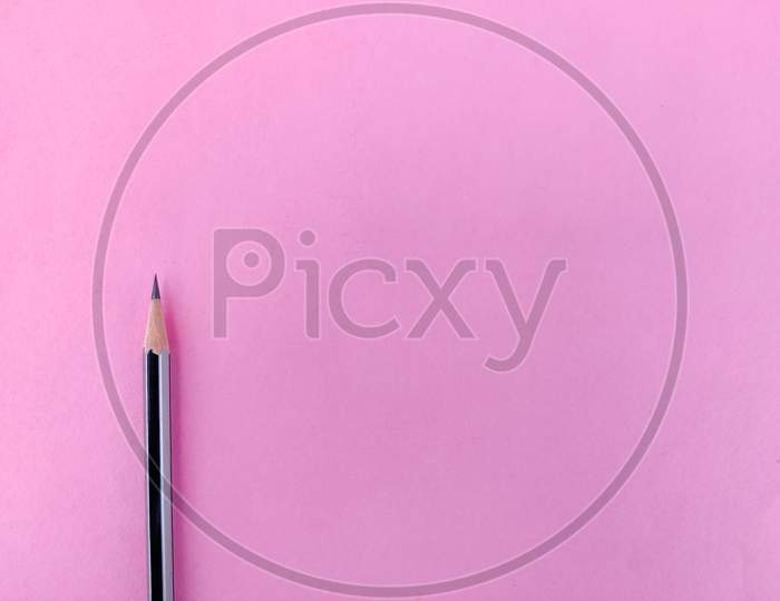 Copy Space Of One Black Color Pencil With Sharp Lead Isolated On Pink Background
