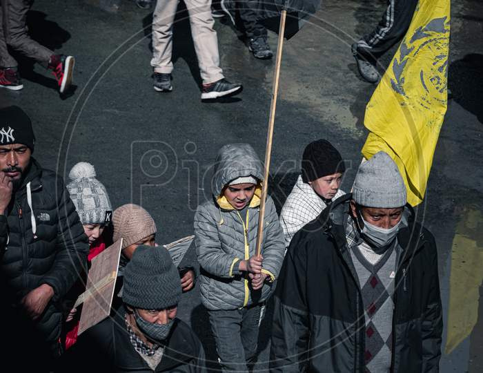 young boy holding flag