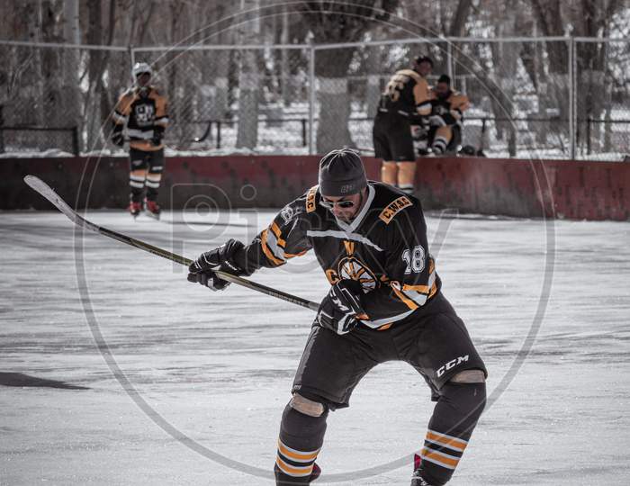 ice hockey player shooting