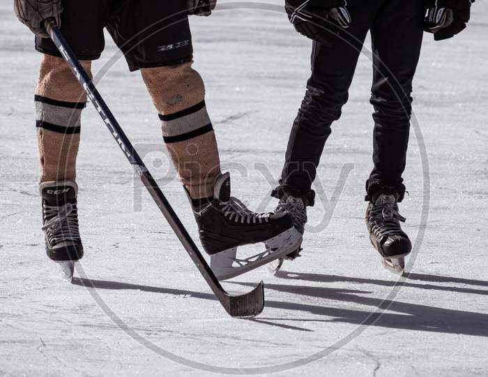 ice hockey stick and shoes