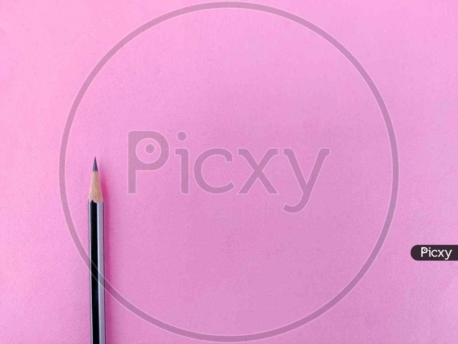Copy Space Of One Black Color Pencil With Sharp Lead Isolated On Pink Background