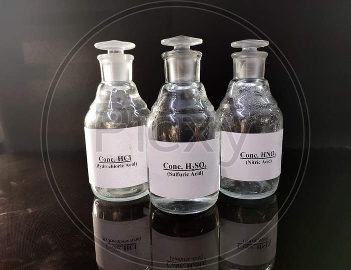 Transparent Bottles Filled With Concentrated Acid