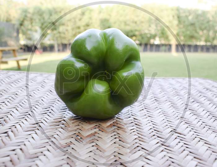 Side View Of Green Capsicum Or Green Bellpepper On White Background. Asian Organic Fresh Short Type Of Shimla Mirch Vegetable