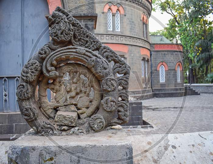 Picture Of Ruined Ancient Grey Stone Carving Of Hindu God And Goddess In Town Hall Kolhapur City India.