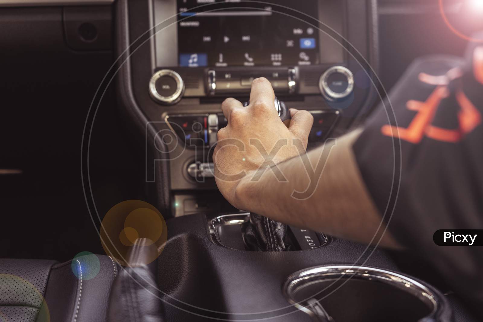 Close Up Of Hands Holding The Gear Of A Car. Interior Of A Luxury Car.