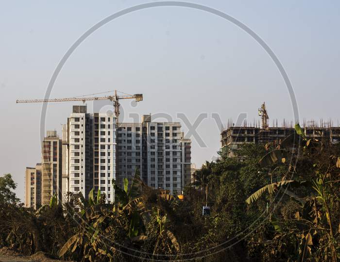 A Highrise Residential Building Under Construction In A Sunny Day.