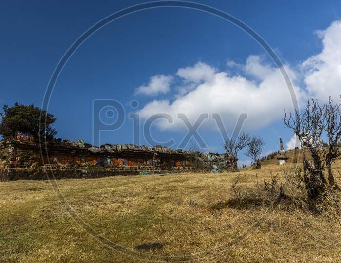 A Ruin Of A Monastery At Chitre Near Darjeeling With Blue Sky And White Clouds.
