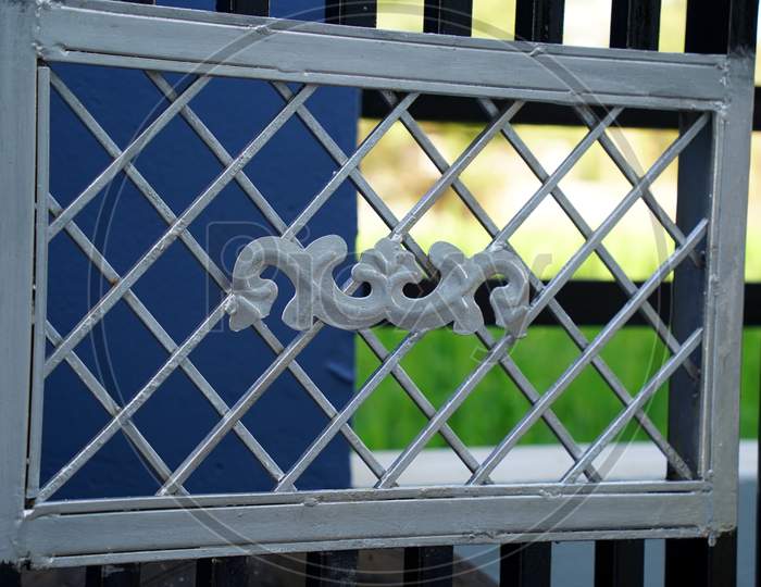 Metal Silver Color Fence Fitted In A Enter Gate For Security Purpose. Security Fence With Silver Color Paint.