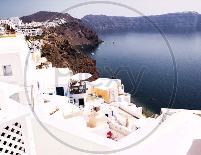 Wide Angle View Of White Washed Houses And Buildings On Volcanic Mountain Cliff Firostefani, Santorini, Cyclades, Greek Island Travel Santorini Greece Architecture