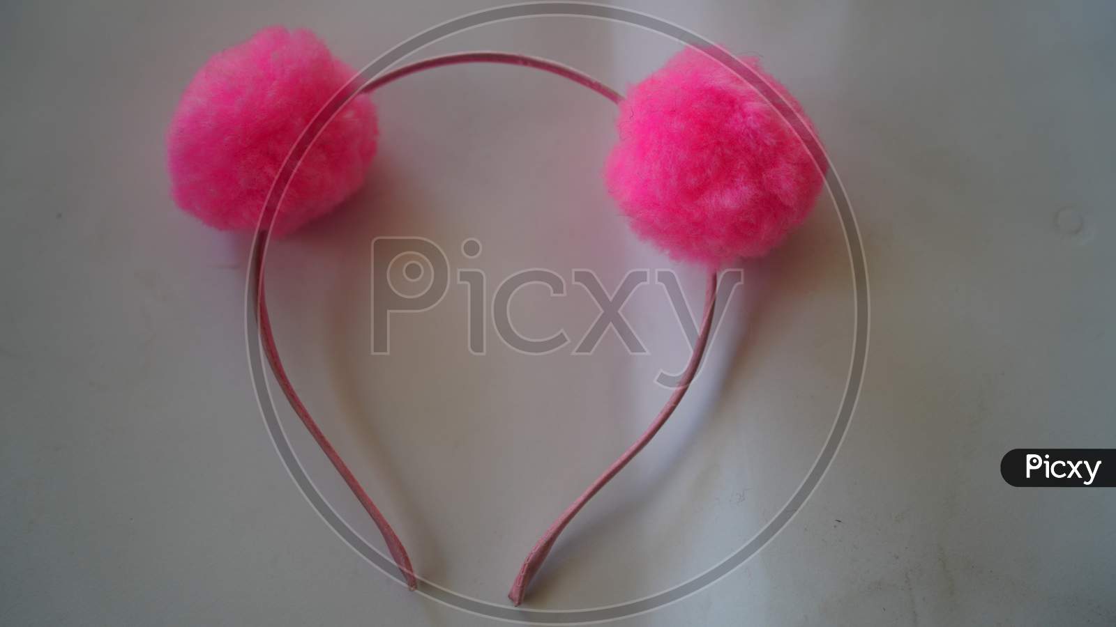 Pink Head Band Closeup To Bind Hair. Isolated Shot Of Pink Hair Band For Teen Girls And Females. Elastic Fiber Hair Band Closeup Shot.