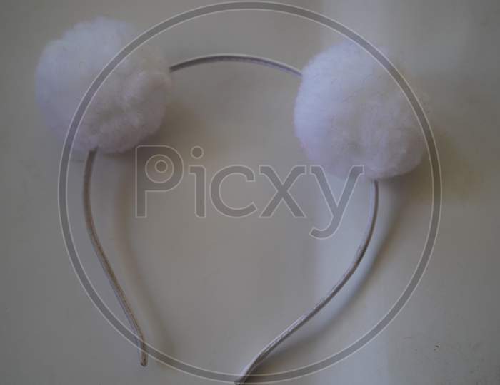 Attractive View Of White Hair Band Or Head Band With White Background. Closeup Shot Of Hair Care Accessory.