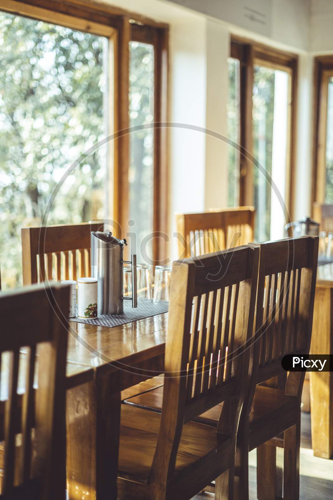 Shot Of A Dining Table With Focus On The Dining Chairs Captured In Interior Of A Restaurant.