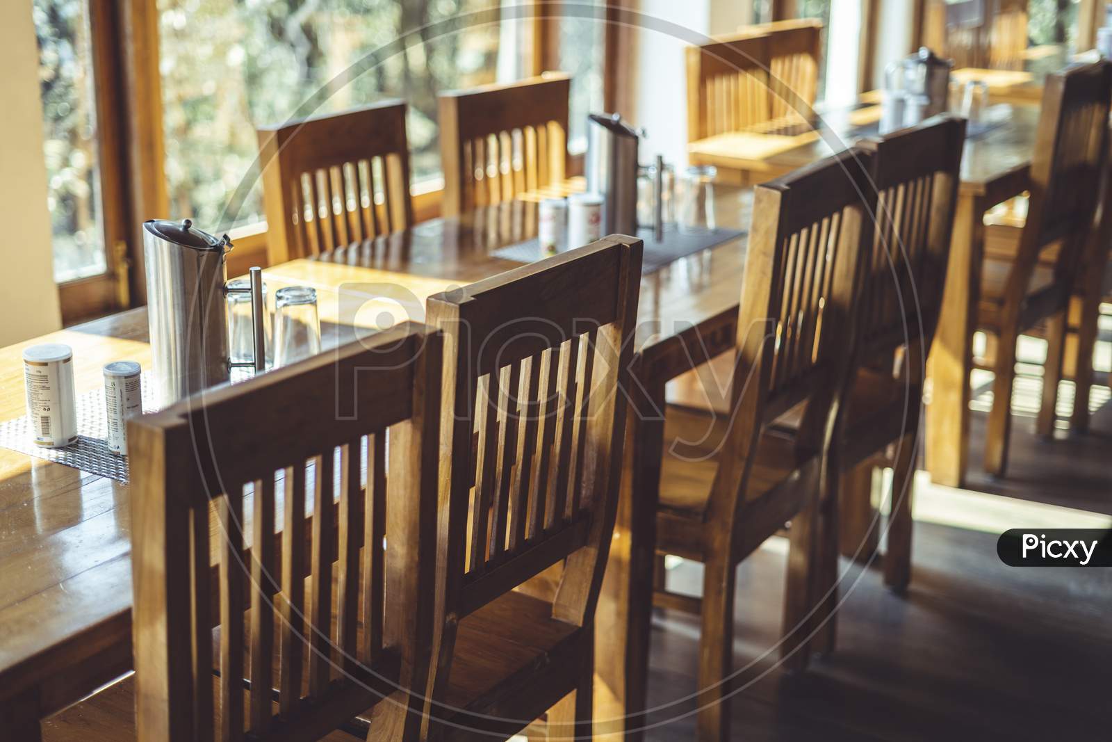 Shot Of A Dining Table With Focus On The Dining Chairs Captured In Interior Of A Restaurant.