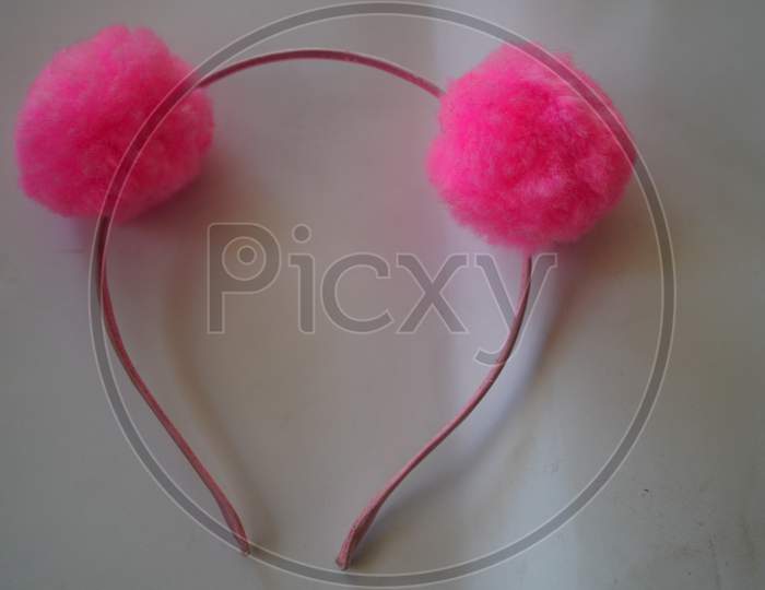 Pink Head Band Closeup To Bind Hair. Isolated Shot Of Pink Hair Band For Teen Girls And Females. Elastic Fiber Hair Band Closeup Shot.