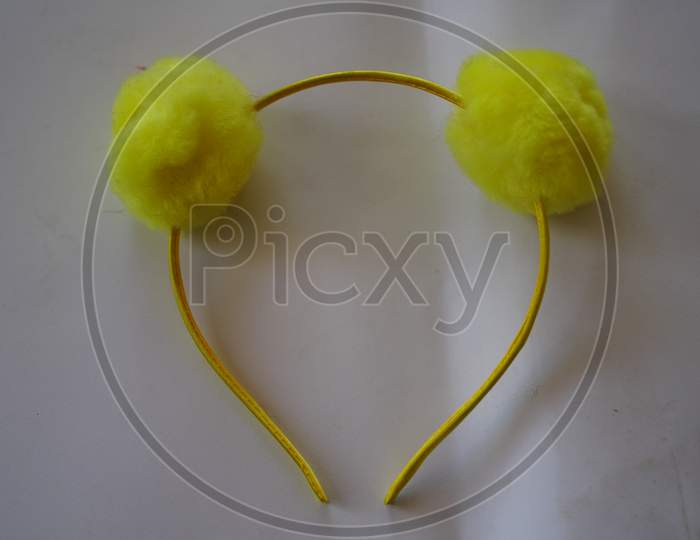 Decorative Fashionable Yellow Hair Band Or Head Band With Attractive View. Bright Flexible Hair Ribbon Closeup.