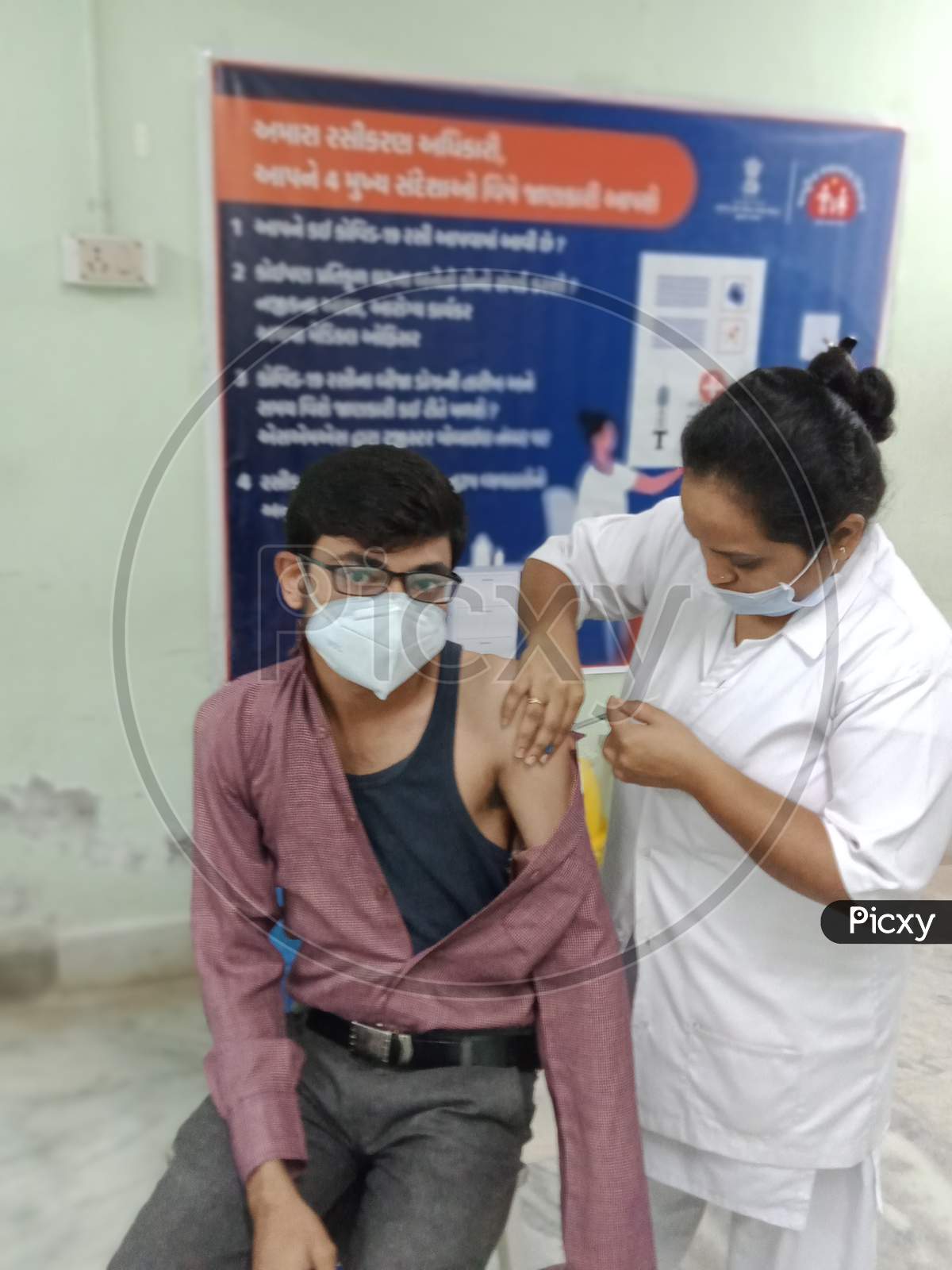 A person taking covid-19 Vaccine