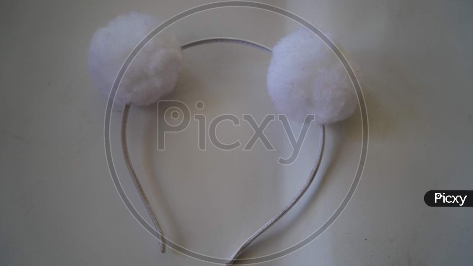 Attractive View Of White Hair Band Or Head Band With White Background. Closeup Shot Of Hair Care Accessory.