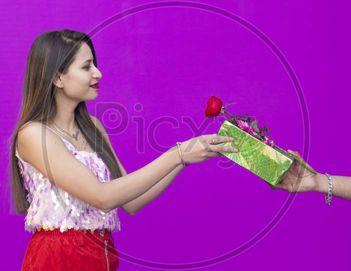 Valentine's Day, Beautiful girl carrying flowers and Gifts from boy on Valentine's Day