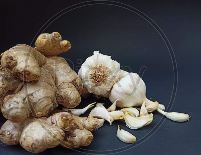 Ginger garlic on black background
