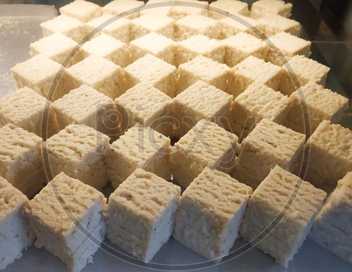 Bengal sandesh or sondesh made of milk kheer displayed in a sweet shop at Bagdogra, West Bengal, IndiaBengal sandesh or sondesh made of milk kheer displayed in a sweet shop at Bagdogra, West Bengal, India