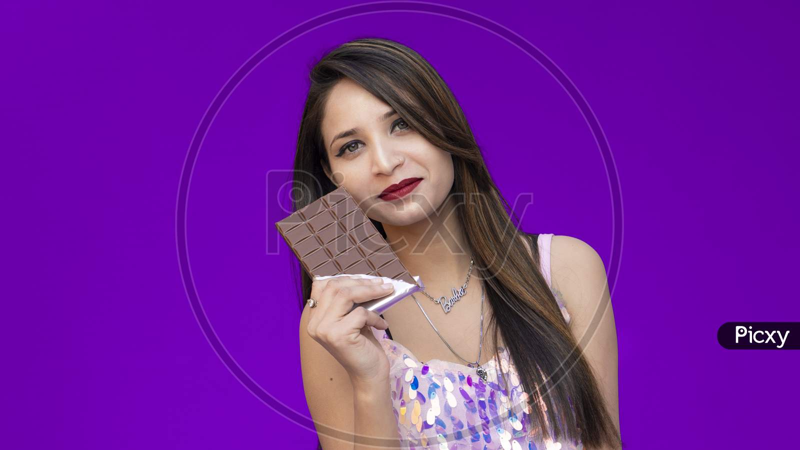 Image of A Beautiful girl poses with chocolate, Chocolate Day-OQ896907-Picxy