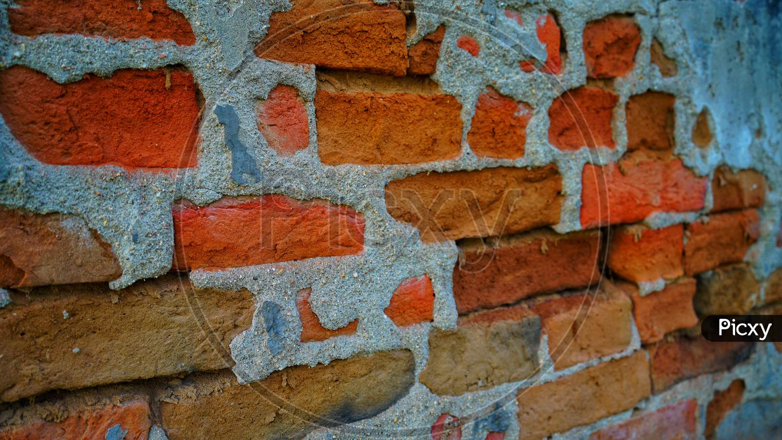 Empty Old Brick Wall Texture. Painted Distressed Wall Surface. Grungy Wide Brick Wall. Grunge Red Stonewall Background.