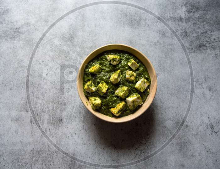 Top view of Palak paneer or cottage cheese cubes in spinach curry