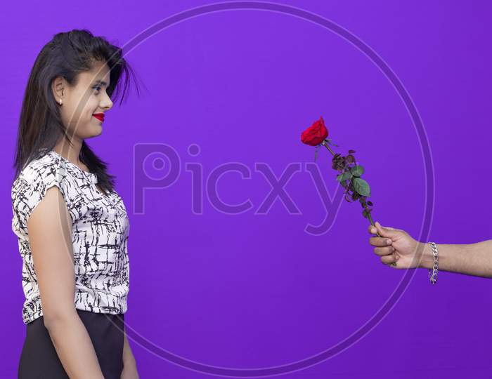 Valentine's Rose Day, Beautiful girl carrying flowers from boy on Valentine's Day