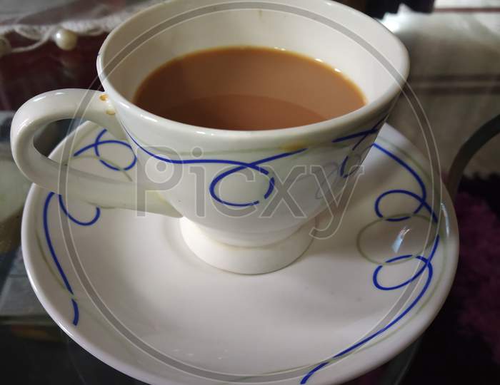 Tea Is Serving In White Cup And Plate Selectively Focused.
