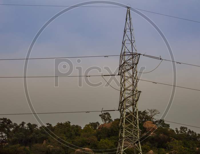 High Voltage Electric Poles For Power Transmission Passing Through Reserve Forest. Power Distribution From Power Plants.