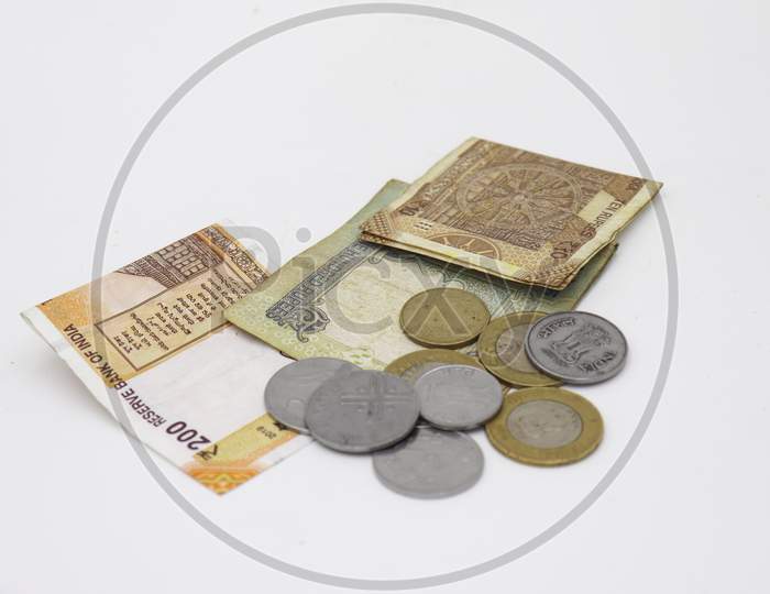 Image of Indian currency and coins isolated on white background