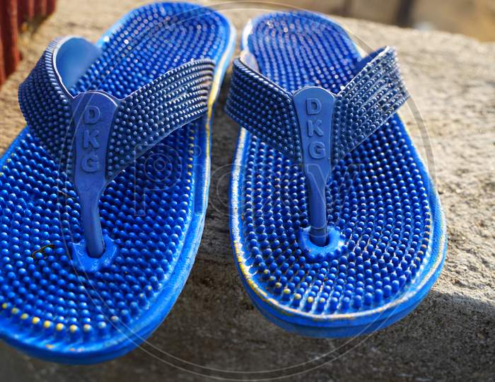 Pair Of Sleepers Manufactured By Elastic Rubber. Fancy Stylish Fashionable Sandals Closeup To Running.