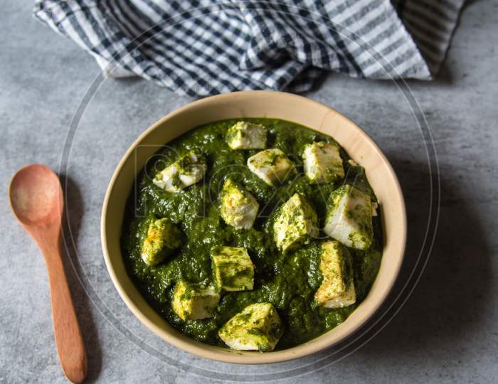 Palak paneer or spinach in cottage cheese curry on a  background. Traditional Indian food.