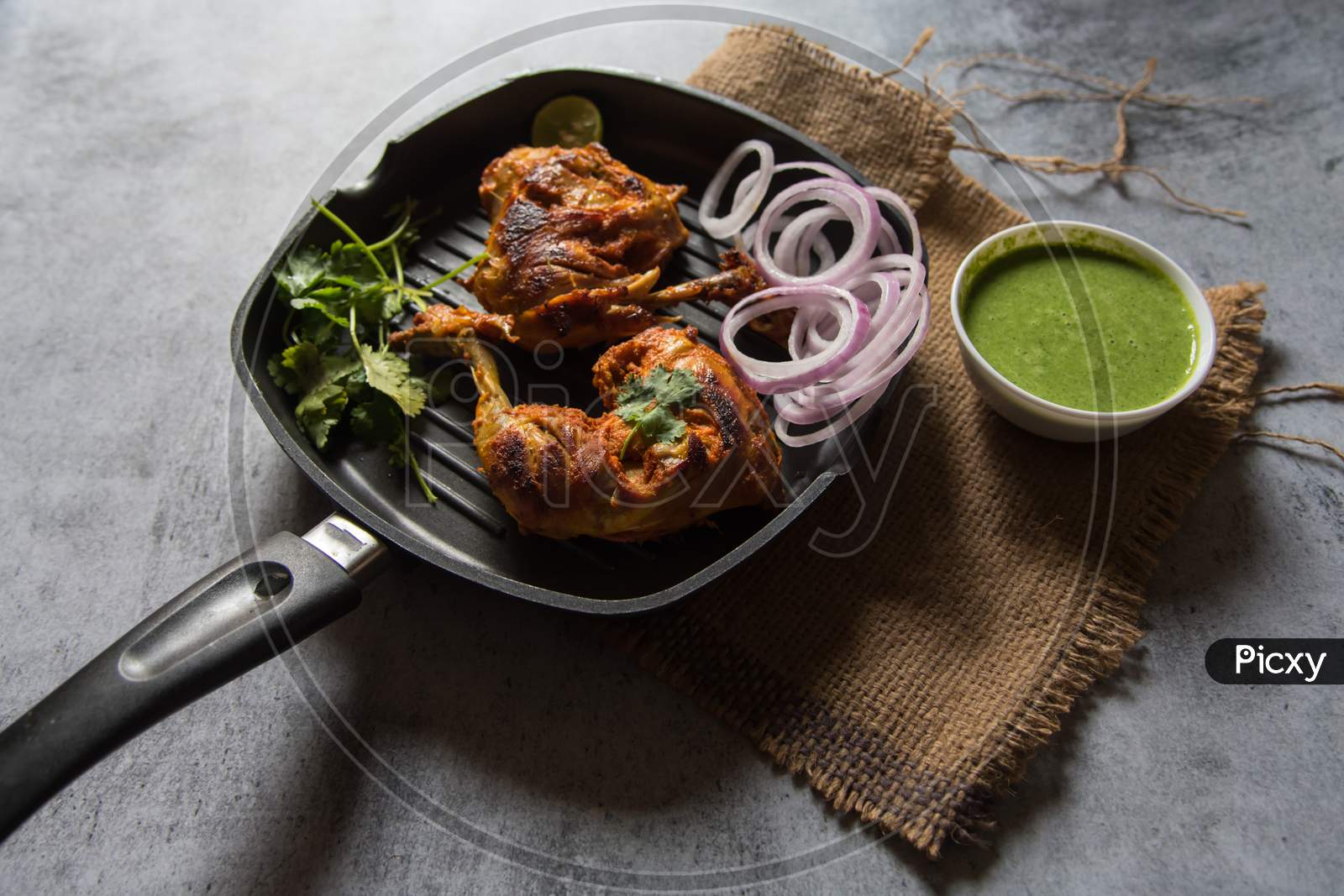 Close up of  popular Indian snacks chicken tandoori in a pan