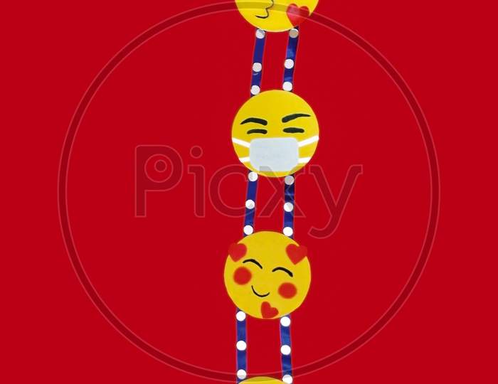 Children craft work smiley emoji for wall hanging