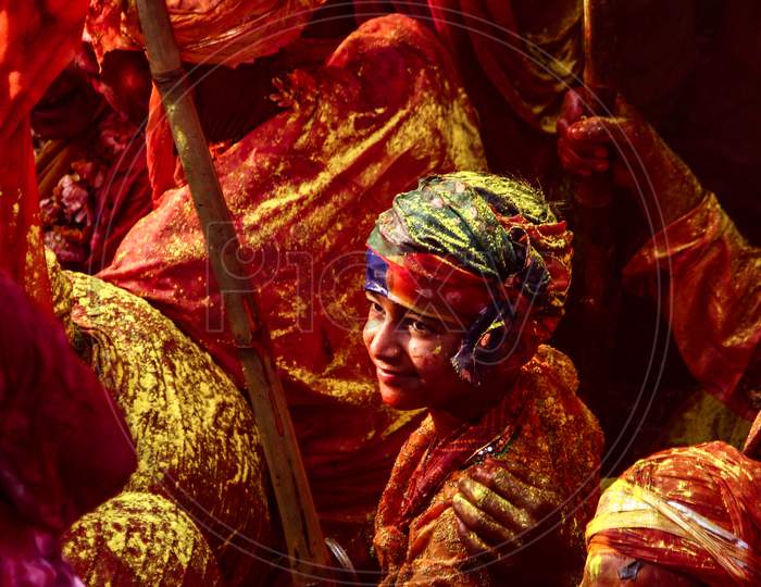 Barsana, Uttar Pradesh, India February 6 2021: People Of India Celebrating Holi In The Holy State Of Mathura. Lathmaar Holi Being Played In Nandgaon. People Covered In Colors.