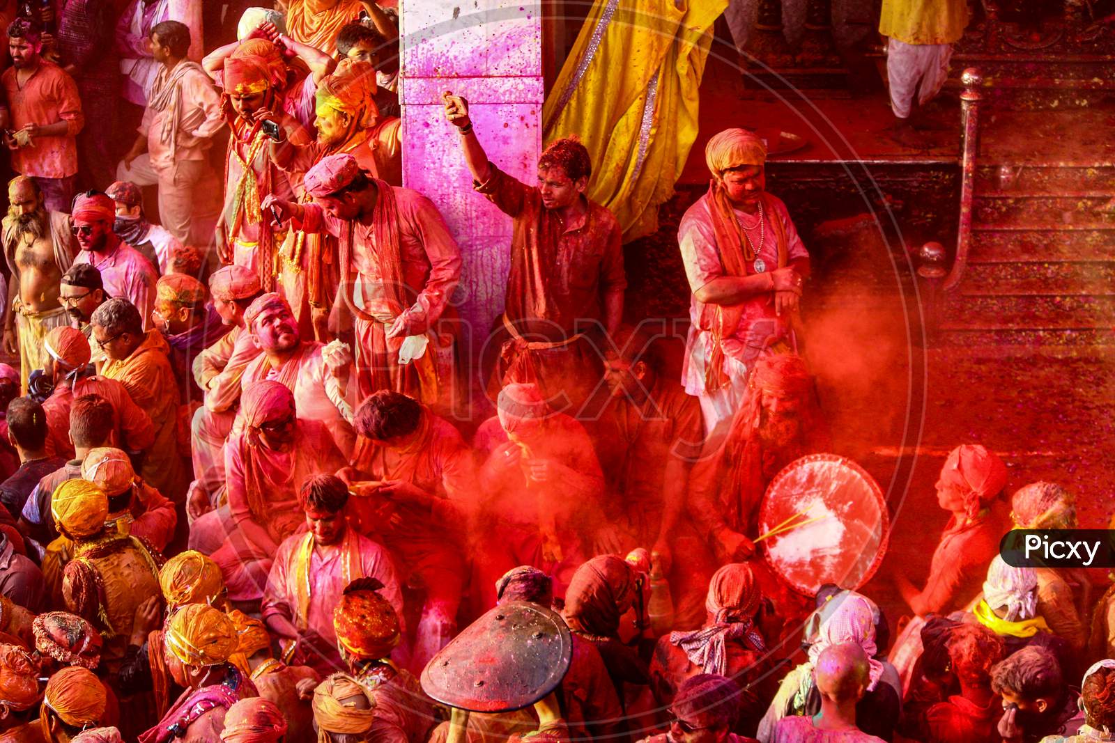 Barsana, Uttar Pradesh, India February 6 2021: People Of India Enjoying The Festival Of Holi By Throwing Colors Onto Each Other. Festive And Colors Concept.