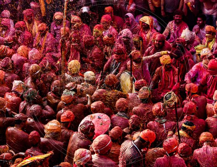 Barsana, Uttar Pradesh, India February 6 2021: People Of Barsana Mathura Playing Holi And Are Covered In Holi Colors During Holi Festival