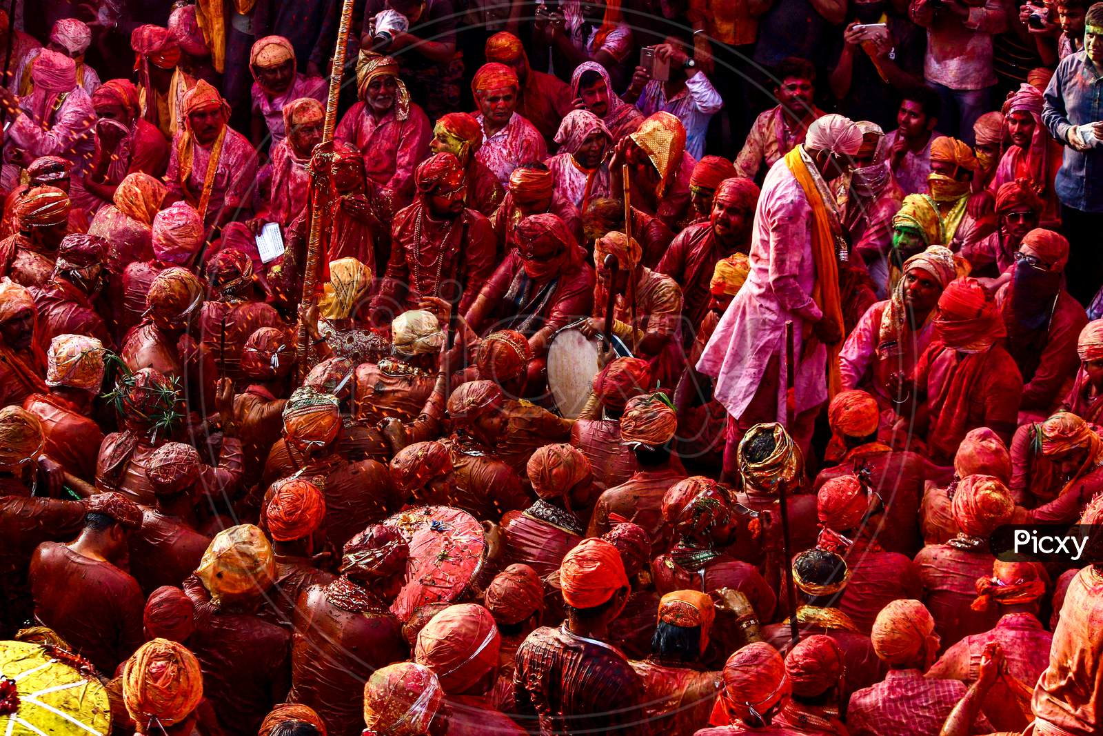 Barsana, Uttar Pradesh, India February 6 2021: People Of Barsana Mathura Playing Holi And Are Covered In Holi Colors During Holi Festival